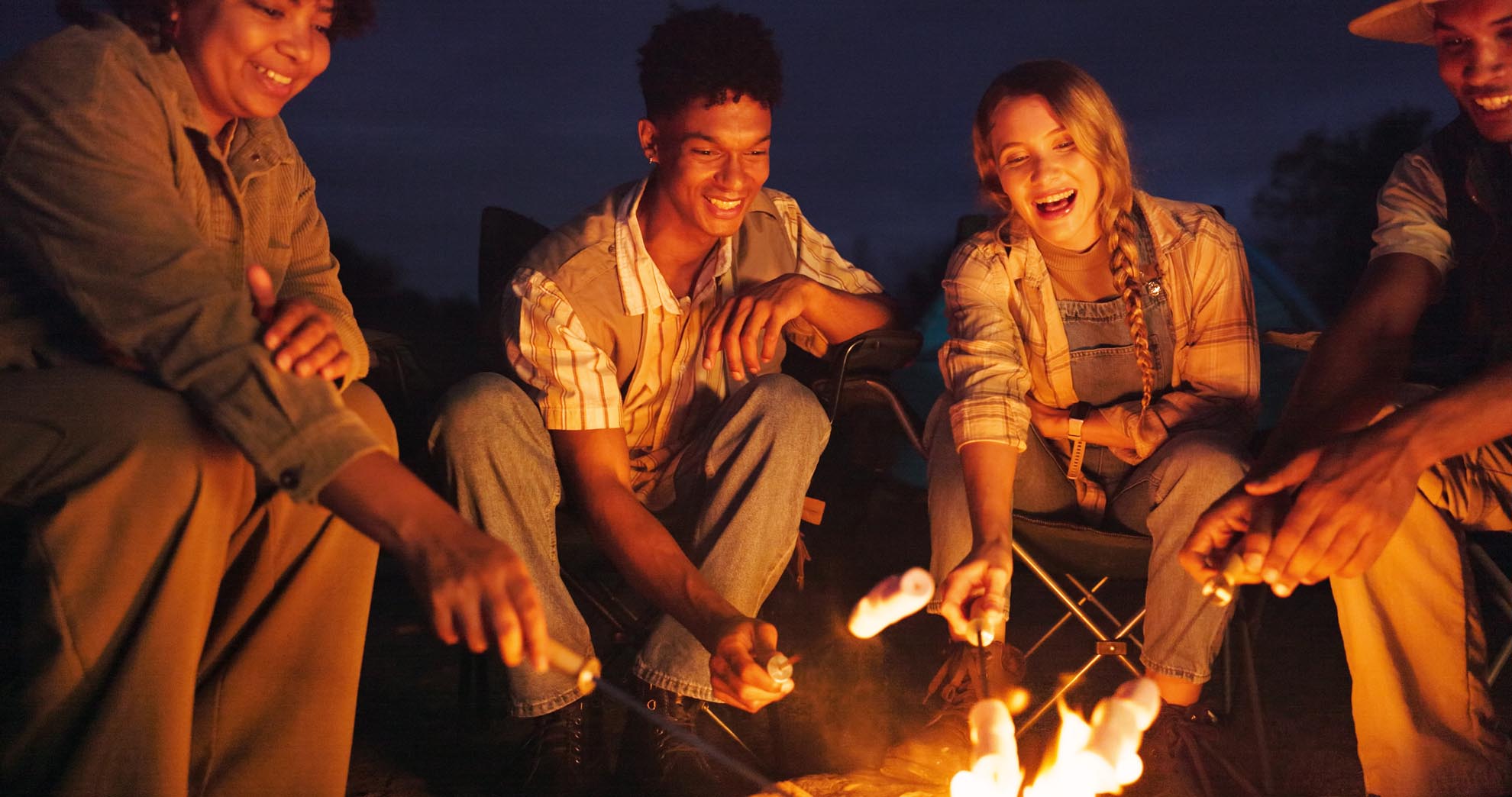 Friends camping roast marshmallow night with campfire adventure social gathering smile people