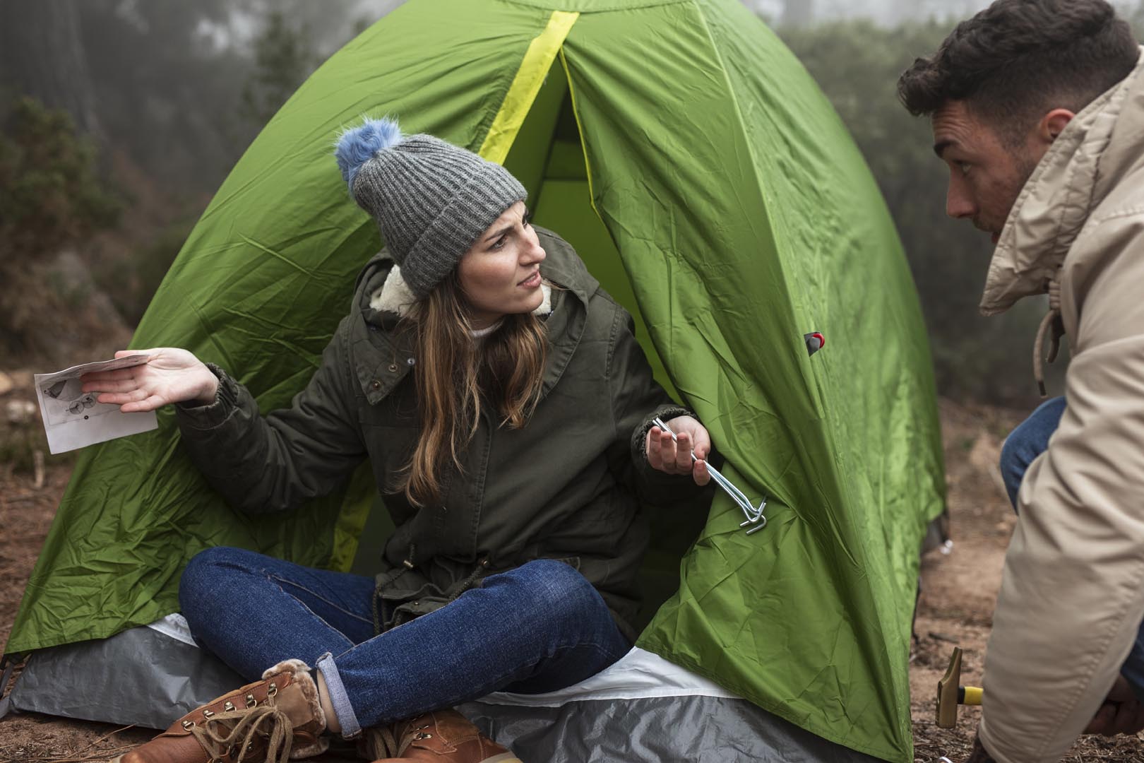 People with map tent talking