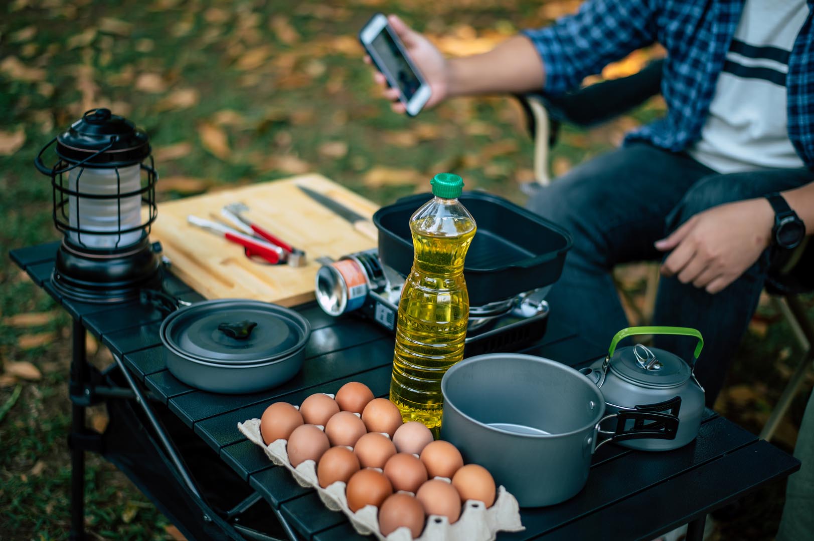 Portrait asian man glasses cooking campsite outdoor cooking traveling camping lifestyle concept