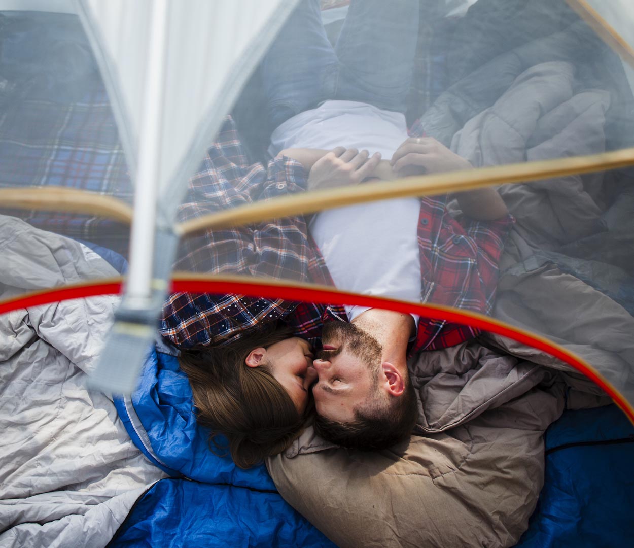 Top view couple hugging tent