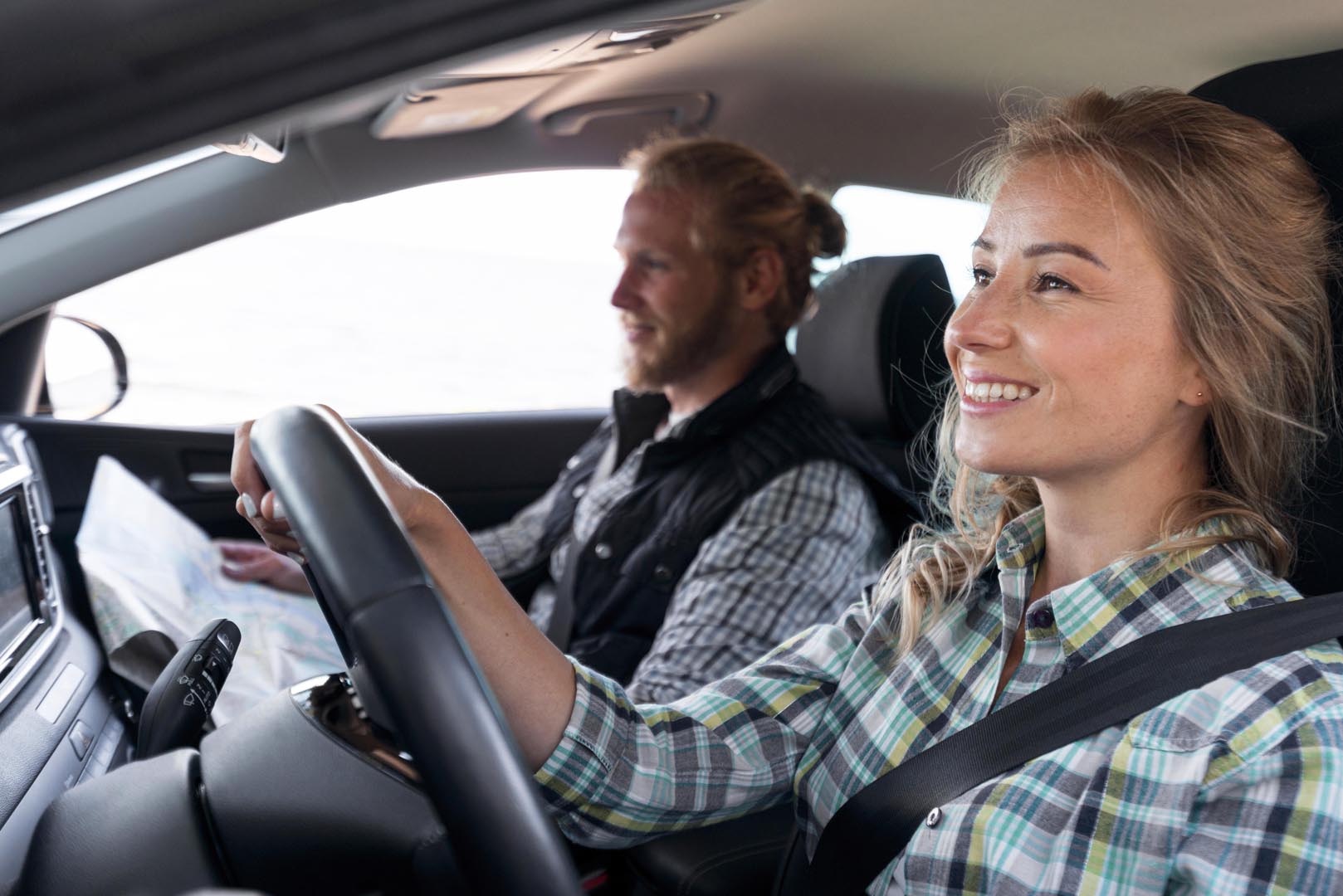 Woman driving searching camping place
