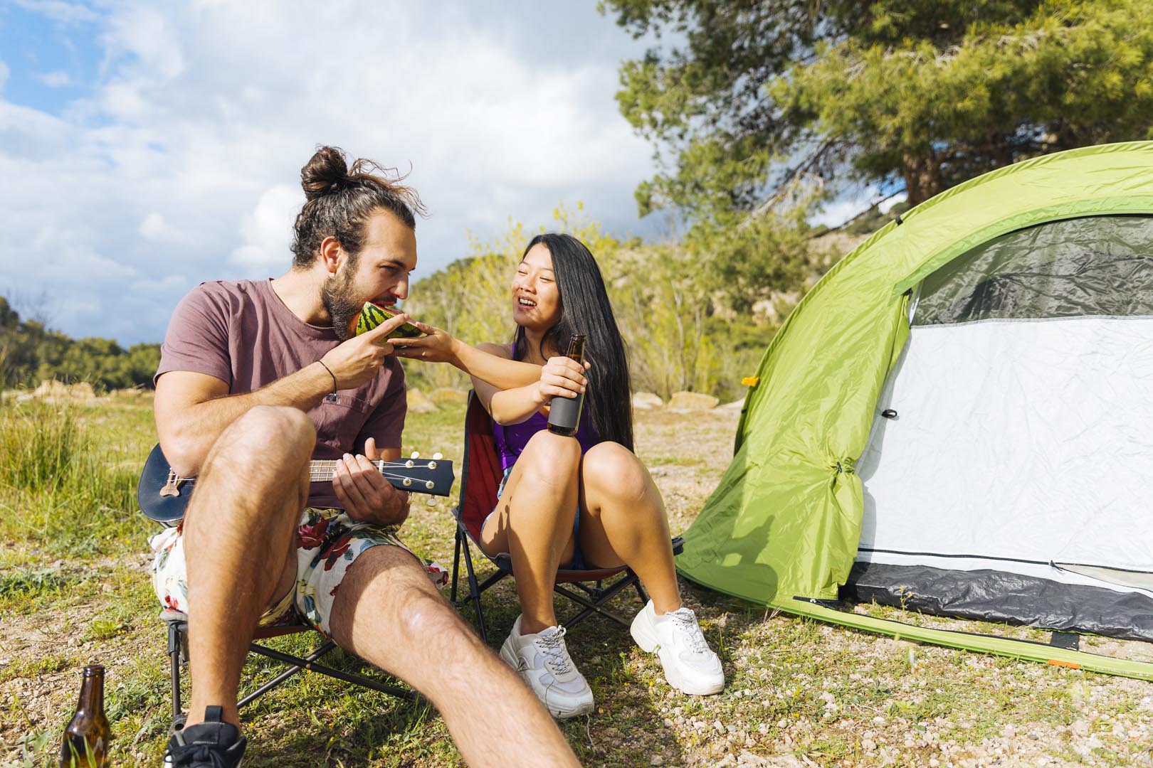 Young couple camping lawn